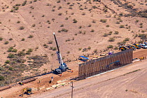 Aerial view of construction of the controversial southern border wall between Arizona and Sonora, Mexico. This is being converted from a ten foot wall to a thirty foot high barrier in accordance with...