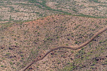 Aerial view of border Wall between Arizona, USA. and Sonora, Mexico, a ten foot high wall which will be replaced by Trump&#39;s thirty foot high barrier. The wall passes through the pristine Sonoran D...