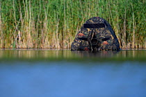Floating hide with camera lens visible, for photography in the Nemunas Delta Nature Reserve, Lithuania.