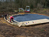Preparatory work for construction of educational dipping pond with the liner in place, Blashford Lakes Nature Reserve. Hampshire and Isle of Wight Wildlife Trust Reserve, Ellingham near Ringwood, Hamp...