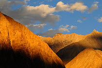 Sunset over the mountains, Nubra Valley, Karakorum Wildlife Sanctuary, Ladakh, India. September 2011.