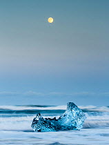 Ice sculptures and full moon. The ice comes from the Jokulsarlon Glacier close by. Iceland 2016