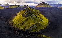 Green mountains in black landscape. Iceland October 2017