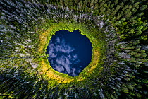Aerial view of a small forest lake in Karula National Park, Valgamaa county, Southern Estonia. Highly commended in the Wildlife Photographer of the Year Awards 2019.