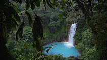 Slow motion panning shot of Rio Celeste waterfall, Tenorio Volcano National Park, Costa Rica, 2019.