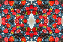 Kaleidoscopic image of berries: strawberries, blue berries, raspberries and blackberries.