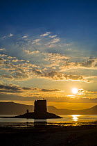 Castle Stalker, medieval four-story tower house / keep at sunset in Loch Laich, inlet off Loch Linnhe near Port Appin, Argyll, Scotland, UK. June 2018