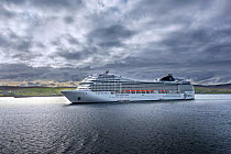 Cruise ship leaving Lerwick harbour, Shetland Islands, Scotland, UK. May 2018