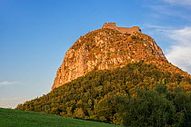 Ruins of the medieval Chateau de Montsegur castle on hilltop at sunset, stronghold of the Cathars, Ariege, Occitanie, France, September 2018