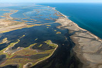 Aerial view of the east coast of Beauduc showing flooded areas caused by sea levels rising, Camargue, France. September 2019.