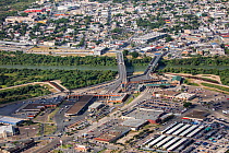 Aerial view of border crossing over Rio Grande towards Tamaulipas, Mexico. Border wall in Hidalgo County, Texas, USA. July 2019.
