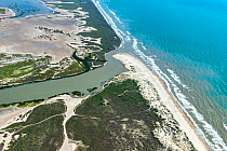 Aerial view of Rio Grande flowing into Gulf of Mexico, the border between Cameron County, Texas, USA and Tamaulipas, Mexico. July 2019.