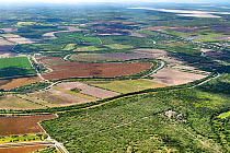 Aerial view of border wall at Southmost Preserve, Texas, USA. 85% of the reserve lies on the no-man&#39;s land side between the wall and the Rio Grande river disrupting The Nature Conservancy&#39;s ac...