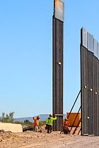 Border wall construction, view from Sonoyta, Mexico towards Organ Pipe Cactus National Monument, Arizona, USA. November 2019.