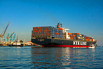 The 300 meter NYK Andromeda gearless container ship departing Long Beach Harbor, California, USA. August 2007.