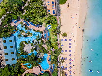 Aerial view of the pool and beach at the Outrigger Hotel on Tumon Bay, Guam, Micronesia, Mariana Islands, Pacific Ocean. September 2017.