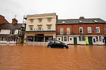 Flooded Regal Theatre and abandoned vehicle, Teme Street, Tenbury Wells, Storm Dennis, Worcestershire, 16 February 2020.