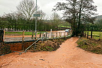 Flooded B4203 with two broken down vehicles, Storm Dennis, River Frome, Bromyard, Herefordshire. 16 February 2020.