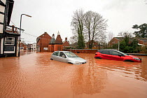 Flooded Cross Street, Tenbury Wells with two abandoned vehicles, Storm Dennis, Worcestershire, 16 February 2020.