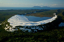 Aerial view of white silica sand dune at Cape Flattery, with Cape Bedford visible in the background. Cape York Peninsula, Australia. June 2012