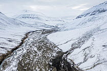 Aerial view of the snow-covered Bolterdalen valley in early autumn. Spitsbergen, Svalbard, Norway.