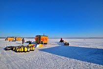 Dive site on ice field, with hut on skates to allow divers to warm up. Karelia, Russia. White Sea.