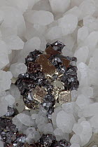 Crystals of Sphalerite (dark colour), Pyrite (golden colour) and Quartz (white colour), Peru