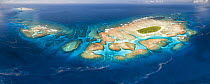 Aerial panorama of Maninita Island which sits atop an extensive coral reef structure, which is for the most part not visible from the surface of the ocean. The reefs extend into the smaller island of...