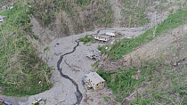 Aerial tracking shot showing aftermath of landslides, two months after hurricane Maria, Dominica, Lesser Antilles, 2018.