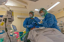 Anesthesiologist and anesthesia nurse during an intubation of a patient infected with Covid-19 in the intubation room of the operating theatre Jeroen Bosch Ziekenhuis, Den Bosch, The Netherlands Mar...