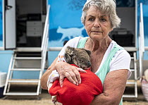 Wildlife rescuer and carer Lorna King leaves the mobile wildlife triage centre at Bairnsdale holding here male koala (Phascolarctos cinereus) named ?River&#39;. River was brought in for a health check...
