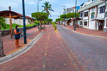 Puerto Ayora, during Covid-19 lockdown, deserted main street and park, normally crowded with tourists and locals, Santa Cruz Island, Galapagos Islands April 2020