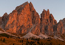 Mountain peaks at Passo Gardena at first light. Dolomites, Italy, October 2019.