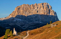 Chapel at Passo Gardena with Sasso Lungo in the background, early morning, Dolomites, Italy, October 2019.
