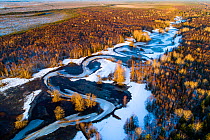 Aerial view of spring melting on the sweeping bends of Lemmjagi River, Soomaa National Park, Viljandimaa County. Estonia, February.