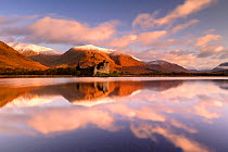 Kilchurn Castle, sunrise, early morning sunlight, a ruin on a rocky peninsula, the northeastern end of Loch Awe, in Argyll and Bute, Scotland, UK. October .