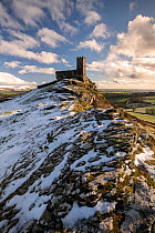 Brentor Church and moorland view after a dusting of snow, near Tavistock, Dartmoor National Park, Devon, UK. January.
