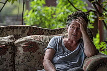 Sharon Small, one of the founders of Goongerah Wombat Orphanage, sitting at home after the 2019/20 bushfires devastated the area. Sharon&#39;s house was spared, but she lamented the loss of her surrou...