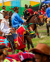 Traditionally dressed Bajau horsemen, also known as the Cowboys of the East, display their riding skills on colourfully dressed Bajau horses, during the Tamu Besar (Big Market) Festival, in Kota Belud...
