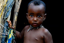 Young child from nomadic herding family, portrait. Northern Benin, 2020.