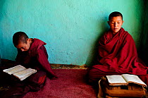 Two young novices studying in small school of the Karsha Gompa, a Buddhist monastery at 3650m altitude founded in the 10th Century. Padum Valley, Zanskar, Ladakh, India. 2011.
