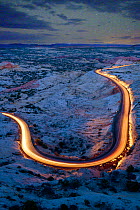Roadway illuminated by cars in Grand Staricase-Escalante National Monument, Utah, USA, March 2019.