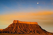Factory Butte and moon setting  near Hanksville, Utah, USA. March 2019.