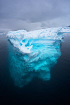 Complete iceberg seen from above and below the surface, floating in Paradise Bay, Antarctica,