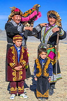 Eagle hunter family, at the Eagle Hunters festival near Ulgii, Western Mongolia.