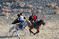 Male-female horse race, at the Eagle Hunters festival near Ulgii, Western Mongolia.