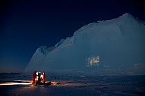 Film projection onto an iceberg, in the Antarctic mid winter. Antarctica June 2012 Editorial use only.