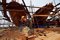 Shipyard for building and renovation traditional wooden fishing boats, in the fishing harbour of Wai Luo Gang, Guangdong province, China November 2015.