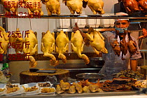Chicken salesman, Li Wan district, Dou Bao road, Guangzhou, Guangdong, China November 2015.