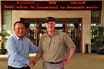 Photographer Staffan Widstrand with the hotel director at Hot spring resort in Xu Wen, Guangdong province, China